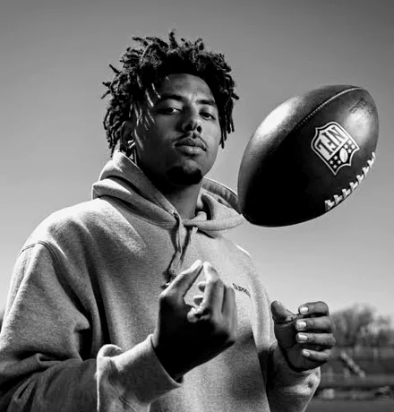 Byron "Peewee" Jarrett Jr. with a football