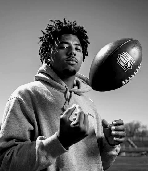Byron "Peewee" Jarrett Jr. flipping a football